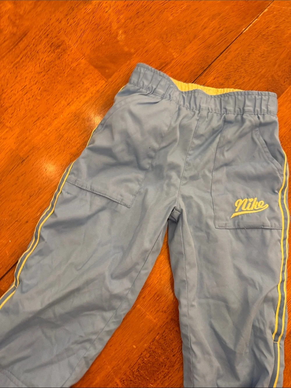 Nike Kids Blue Joggers with Yellow Side Stripes